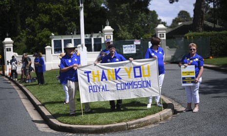 Members of the Care Leavers Australasia Network hold banners thanking the royal commission for its work.