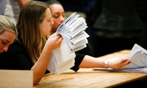 Volunteers count ballot papers at Wandsworth Town Hall after local government elections.