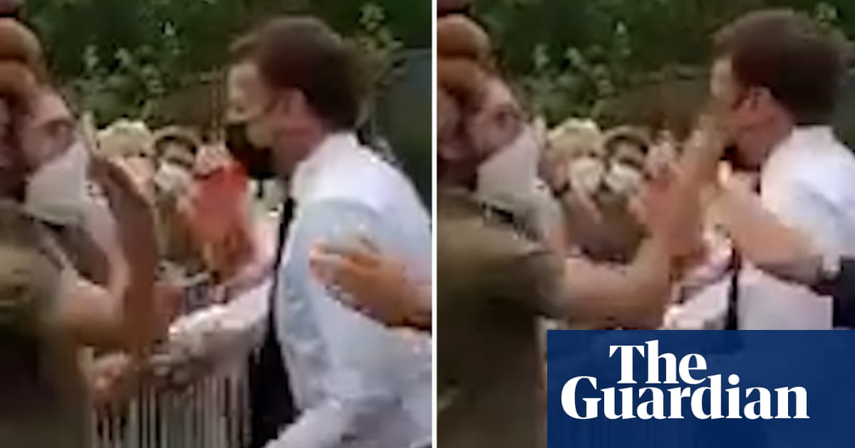 Emmanuel Macron slapped in the face during walkabout – video