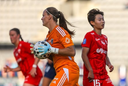 Chengshu Wu (right) rues a missed chance to get the better of Mylène Chavas, the Paris FC goalkeeper