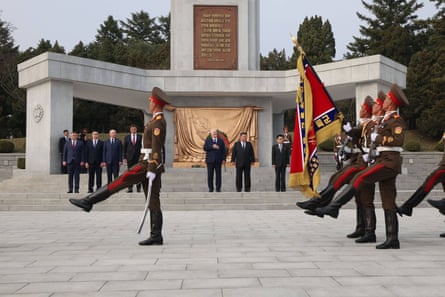 Belarusian president Alexander Lukashenko and Kim Jong-un watch soldiers march
