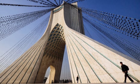 The Azadi tower strung with black flags.