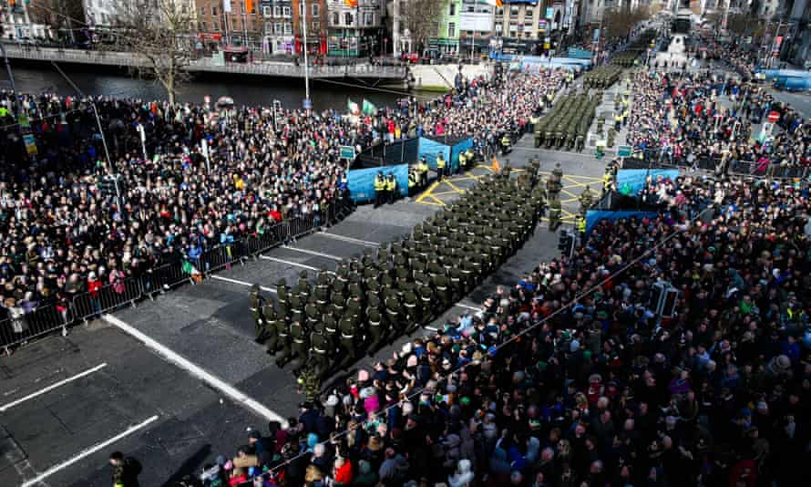 Thousands of members of the Irish armed forces and emergency services march down O’Connell Street in Dublin.