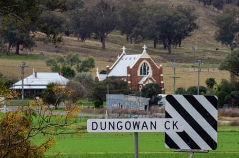 Dungowan village and a Dungowan creek sign, with St Michael Catholic church in background