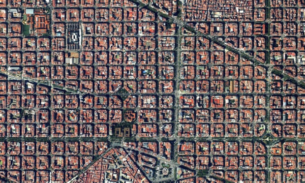 The Eixample district is characterised by its strict grid pattern, octagonal intersections, and apartments with communal courtyards.