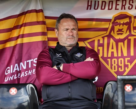 Jim Lenihan, the head coach of Super League team Huddersfield Giants, sits with his arms crossed during his team’s 36-16 Super League loss at home to Toulouse.
