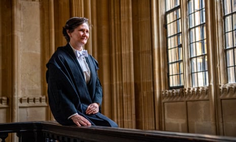 Prof Irene Tracey sitting on a banister