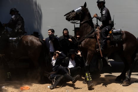 Four men are swept up by horses in a protest