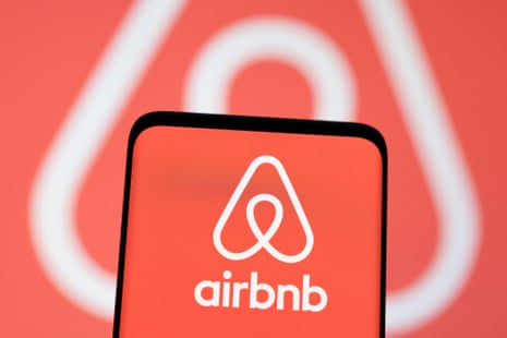 An Airbnb logo on a phone