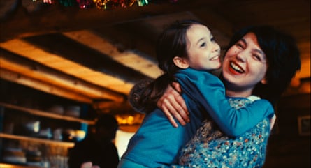 Liliane Sanry-Baud hugs Eva Yelmani in a film still