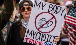 ‘My body, my choice’ – a protester at the state capitol opposes wearing a mask.