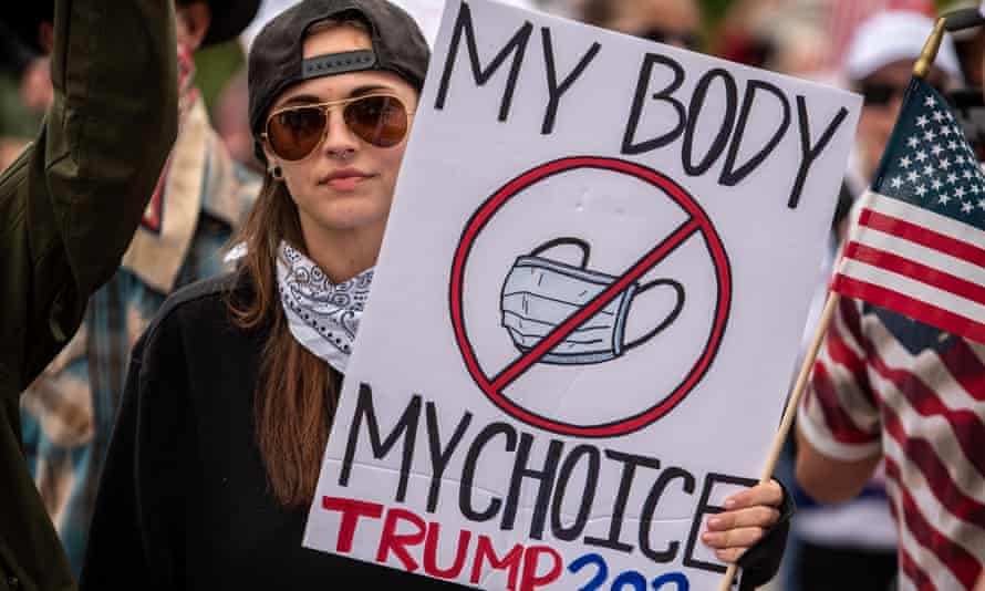 ‘My body, my choice’ – a protester at the state capitol opposes wearing a mask.