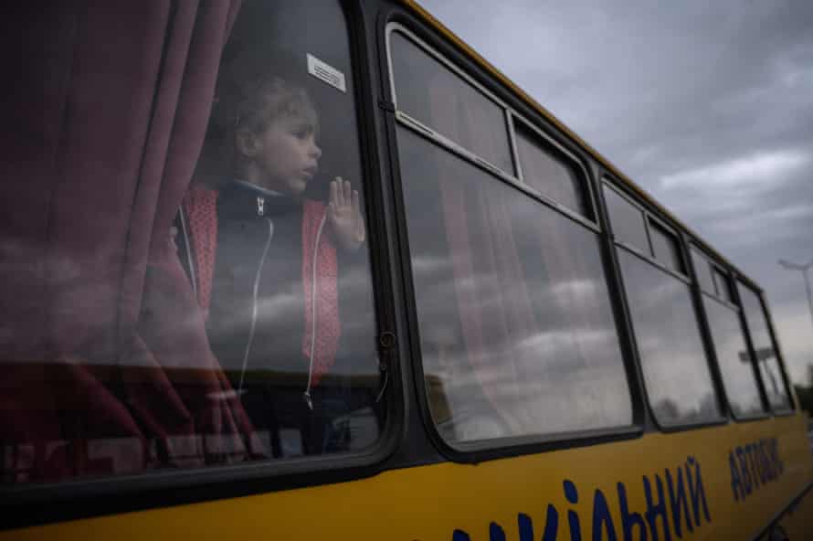 A young girl looks out from a bus in Zaporizhzhia.