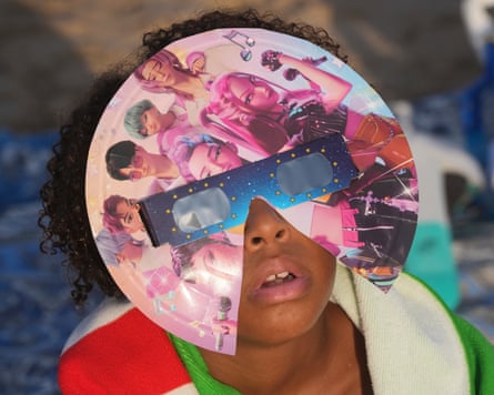APTOPIX Spain Solar EclipseA beachgoer wearing special eclipse glasses looks up during the beginning phase of a solar eclipse at Puerto de Sagunto beach near Valencia, Spain, Wednesday, Aug. 12, 2026. (AP Photo/Alberto Saiz)