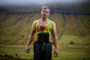 Hjalmar, his shirt stained with blood during sheep slaughtering on a farm in KaldbaksbotnurAtlantic Cowboy provides an insight into how traditional male roles and identity are being challenged by modern society.