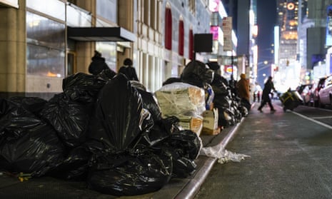 Sitting piles of garbage, that attract rats, in Manhattan.
