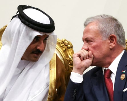 Qatar’s Sheikh Mohammed bin Abdulrahman Al Thani, left, speaks to Jordan’s King Abdullah at the peace summit in the Egypt on Monday.
