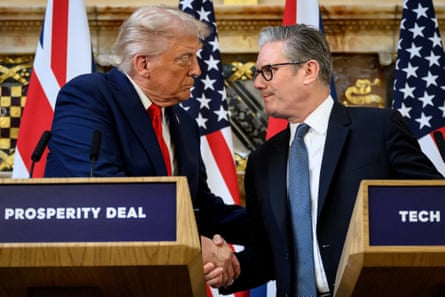 Trump and Starmer shake hands, as they stand at lecterns that say ‘tech prosperity deal’ on the front