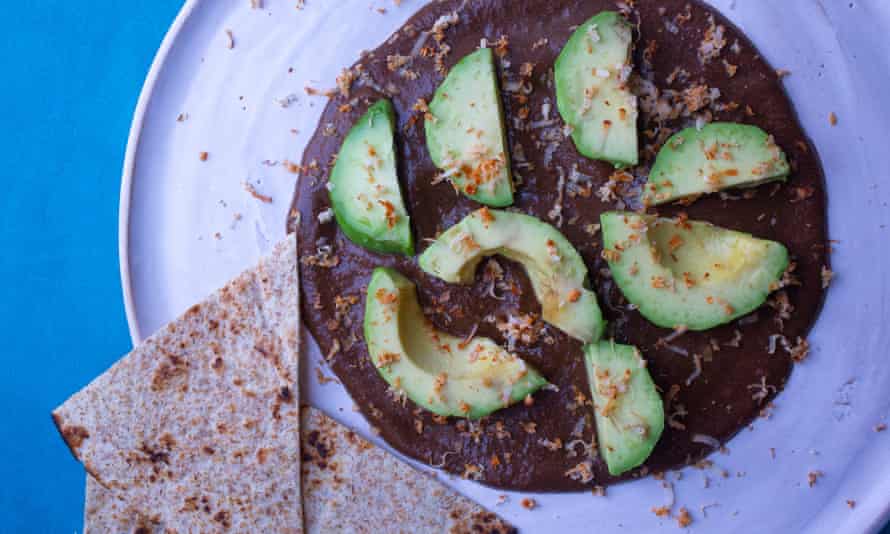 Sublimely satisfying: Tom Hunt’s mole negro with avocado and tacos.