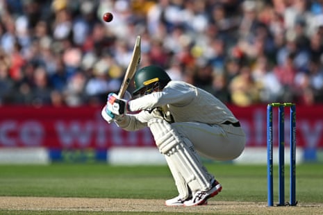 Australia's Alex Carey ducks under a short ball from England's Mark Wood on the opening day of the fourth Ashes cricket Test match between England and Australia at Old Trafford.