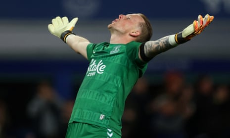 Everton’s keeper Jordan Pickford celebrates his side’s victory as the final whistle goes against Liverpool.