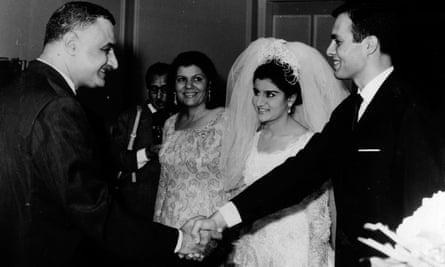 President Nasser of Egypt (left), shakes hands with Ashraf Marwan (right), during Marwan’s wedding to Nasser’s daughter, Mona (centre), on 7 July 1966. 