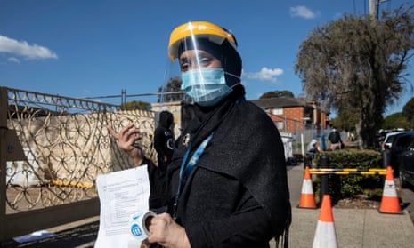 A health worker outside a pop-up vaccination centre in Lakemba.