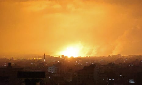 An explosion lights the sky after an airstrike in the northern Gaza Strip