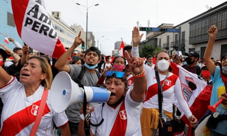Demonstrators attend a protest against Peru's President Pedro Castillo after he had issued a curfew mandate, which was lifted following widespread defiance on the streets, in Lima, on Tuesday.