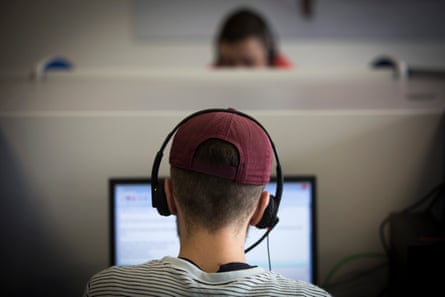 A young man working in a call centre