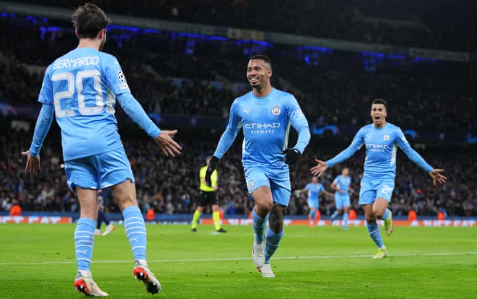 Gabriel Jesus runs to celebrate of Manchester City’s winner against PSG with Bernardo Silva as João Cancelo looks to join the fun