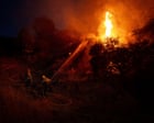 Thousands under evacuation orders in southern California as wildfire threatens homes