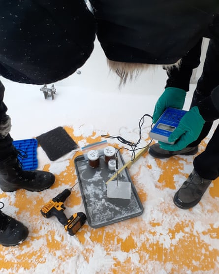 Two people using a probe.