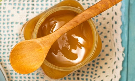 pot of honey with spoon