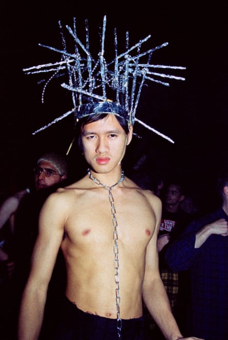 Man in a club with a wire headdress