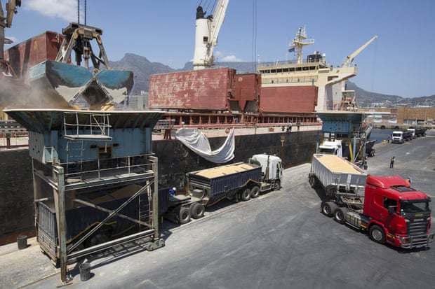 Trucks filled with imported corn maize depart after loading from a cargo ship at the city port in Cape Town, South Africa.