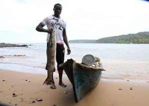 A fisherman on Bom Bom Island, where a new species was discovered in 2006 and more are expected to be found.