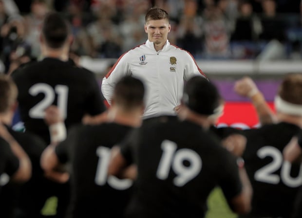 England captain Owen Farrell smiling at the All Blacks as they perform the haka before the 2019 world cup semi-final.