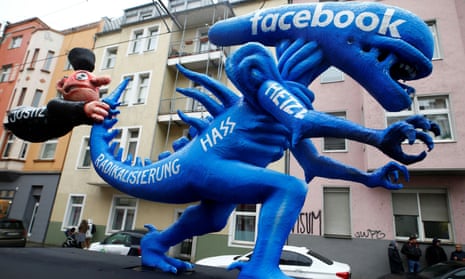 A figure depicting hate speech at Facebook is pictured during the Rose Monday parade in Germany in 2020.