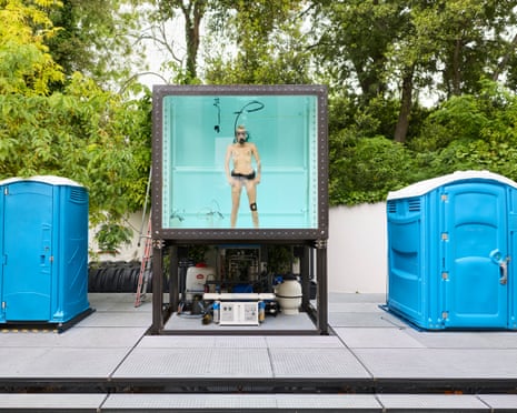 A performer submerged in filtered urine in Florentina Holzinger’s Austrian Pavilion.