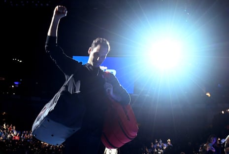 Roger Federer celebrates after winning his group stage match against Novak Djokovic.