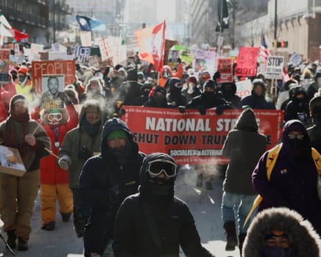 People march through downtown Minneapolis to protest federal immigration enforcement after the fatal shooting of Nicole Good, 23 January 2026.