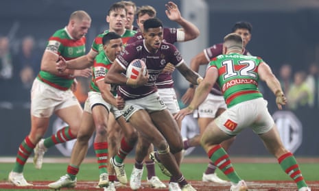 Jason Saab runs the ball in NRL match between Manly and South Sydney in Las Vegas, Nevada.
