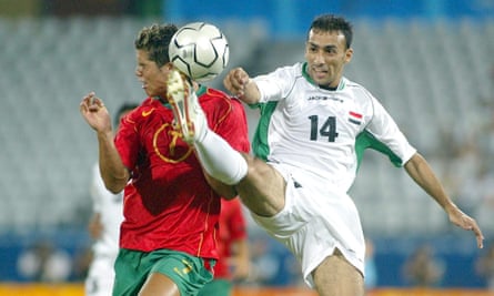 Iraq’s Haidar Amir takes the ball away from Portugal’s Cristiano Ronaldo.