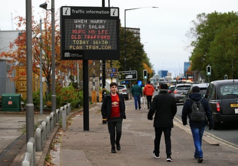 A traffic information road sign is displayed ahead of the game.