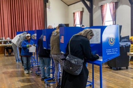A bank of voters cast their ballots at the Community Presbyterian Church on election day in Merrick, New York, on 4 November 2025