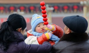 A family in Tiananmen Square, Beijing.