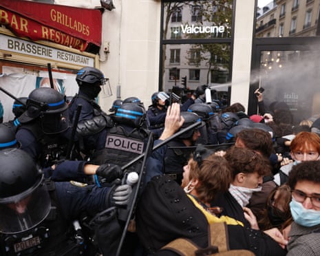 Police spray tear gas as they clash with students on Boulevard Saint-Germain during a protest outside Sciences Po in Paris, France.