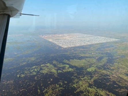 A huge area of flooded land with a precisely marked square of dry land, within which settlements can be seen.