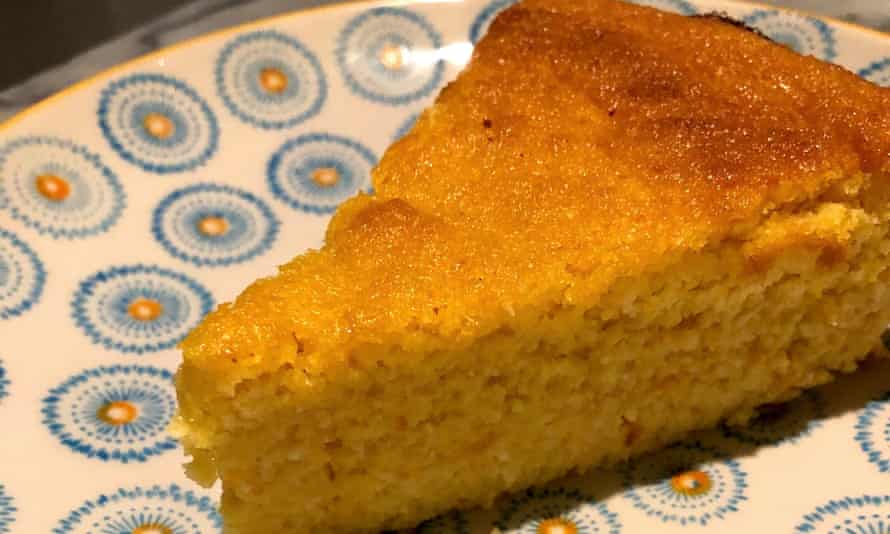 A slice of orange and almond cake on a plate